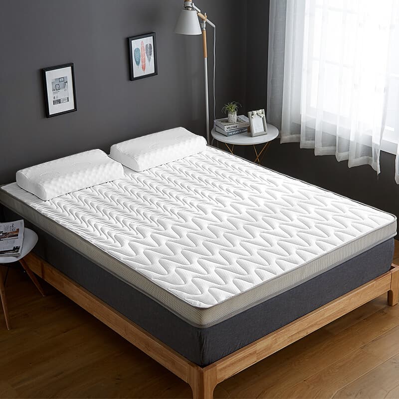 Memory foam mattress contouring around hips in a bedroom